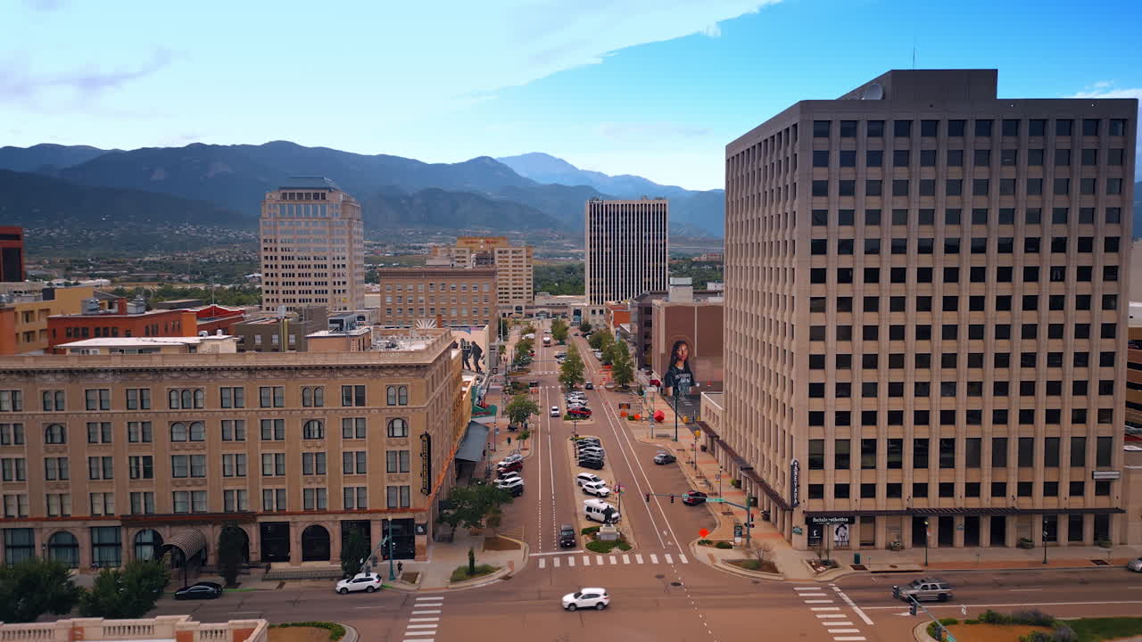 Colorado Springs, USA, 22 July 2025: Going up over the street of Colorado Springs, Colorado, USA. View on the downtown and green uptown surrounded by the mountains