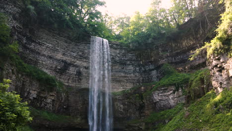 rising aerial dolly of stunning tew falls, ribbon waterfall in ontario canada