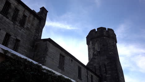 medieval style building silhouetted against evening sky