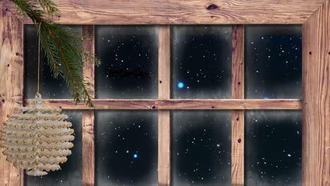 animación de la nieve cayendo sobre la decoración de navidad y la ventana