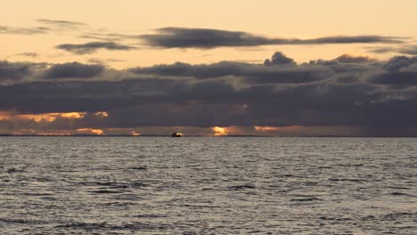 sailing on a ferry through the waters of the pacific ocean in northern chilean patagonia, at sunset. medium shot
