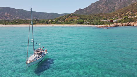 aerial people enjoying on boat at sardinia tropical sea