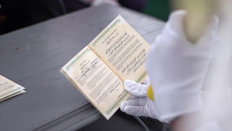 Groom-reads-Sighat-taklik-in-the-marriage-book-at-his-wedding-which-is-a-contract-that-can-be-a-reminder-for-the-husband-of-his-obligations-and-responsibilities