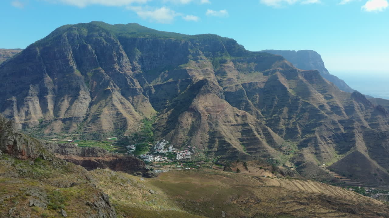 Mountain range in Gran Canaria revealing a small village in the valley, Lomo San Pedro.