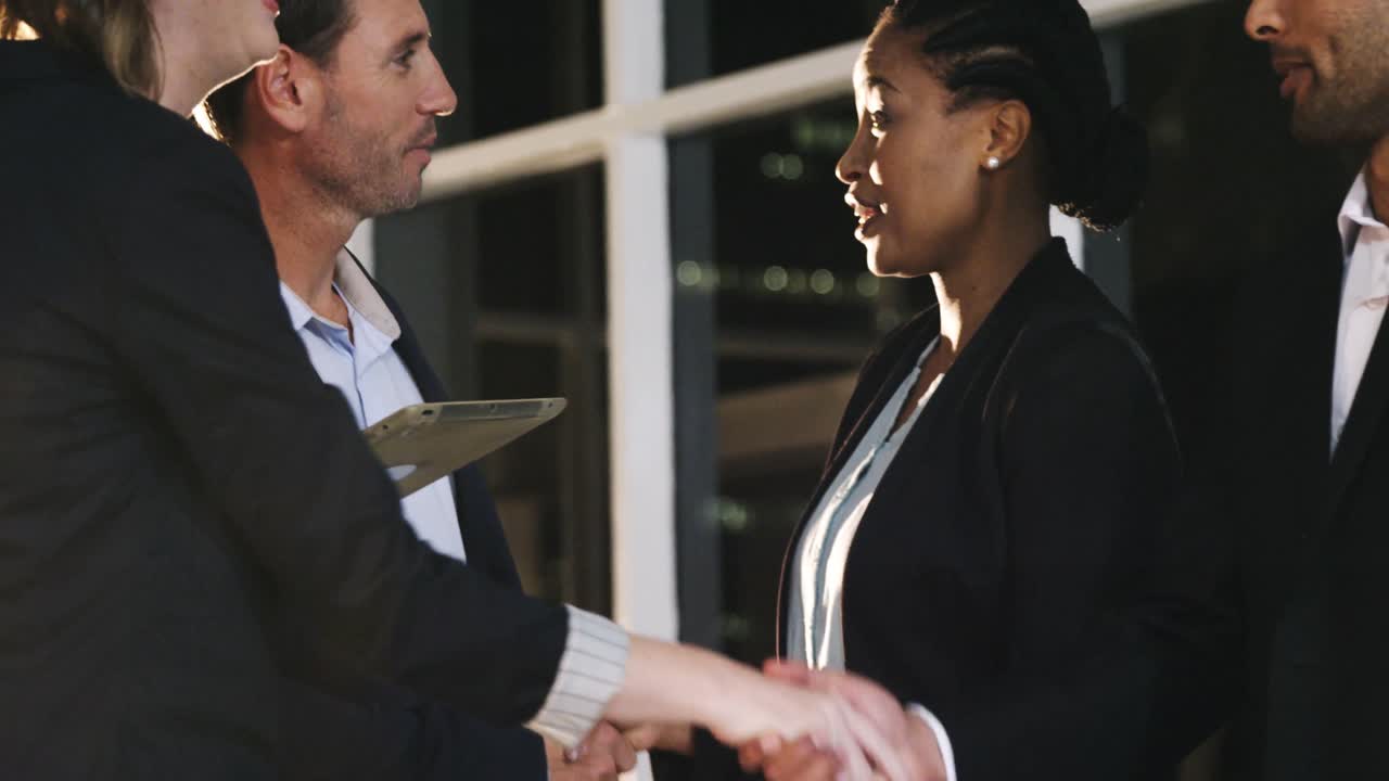 Group of businesspeople discussing together over digital tablet