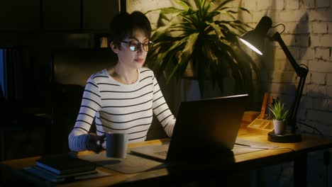 woman working late at night on laptop