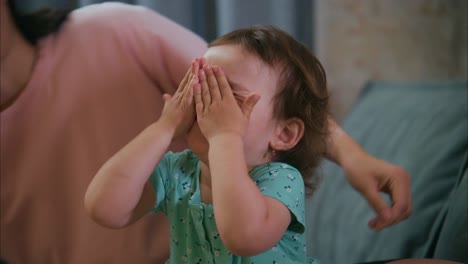 A Heartwarming Moment: A Parent Gently Styles Their Child&#039;s Hair in a Cozy Indoor Setting, Capturing the Bond and Joy in Family Life