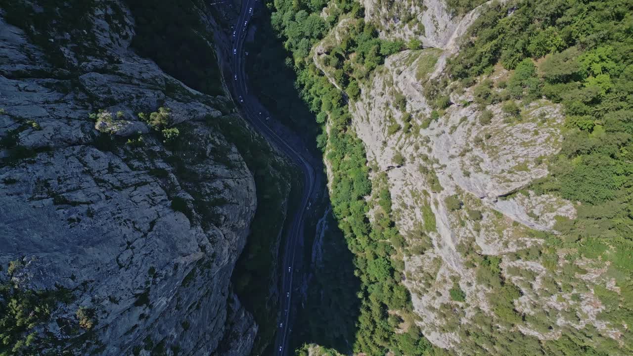 Aerial Top-Down View of a Winding Road in a Deep Mountain Canyon