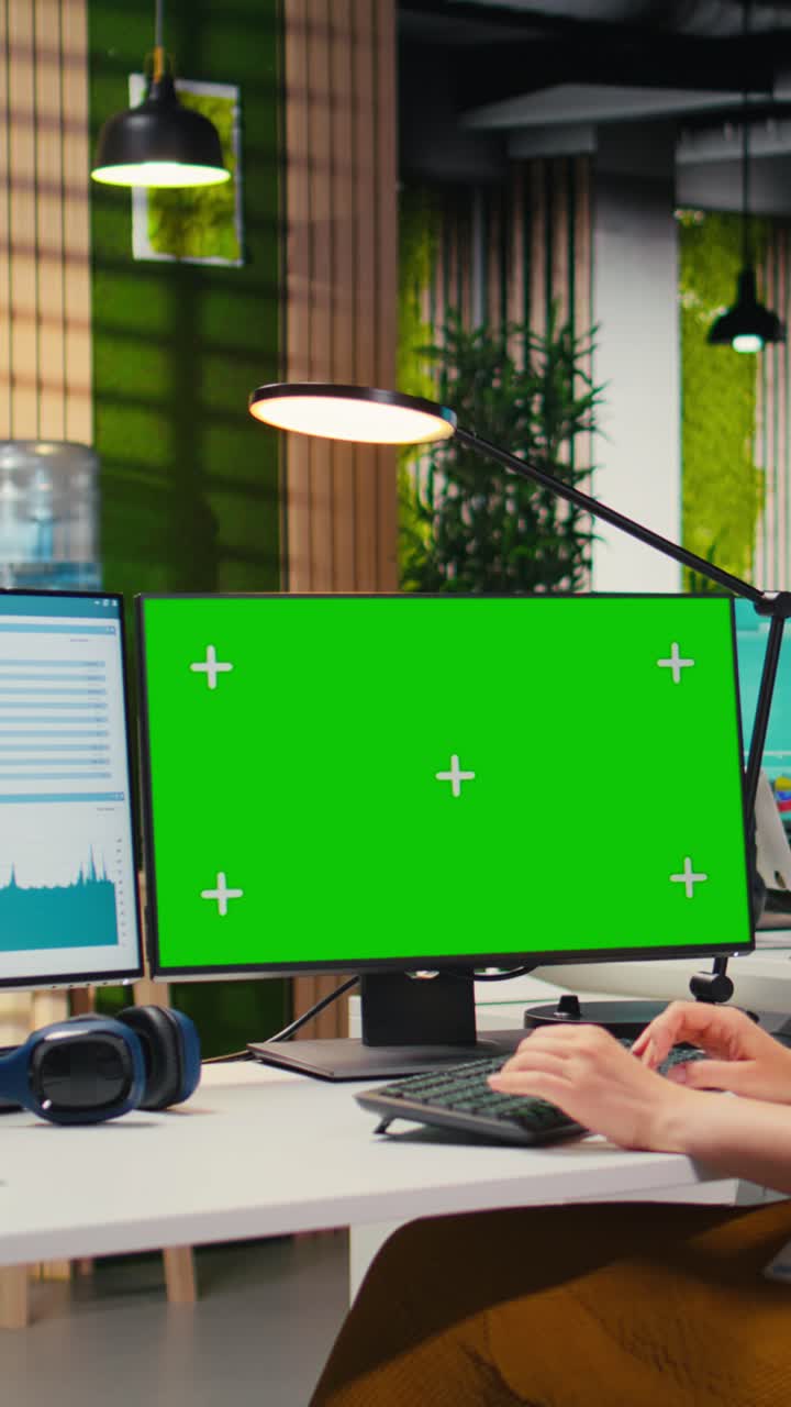 Vertical Video Executive assistant analyzing KPI metrics on computer monitor with mockup