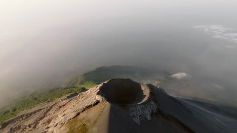 Aerial:-Flying-towards-the-active-Fuego-volcano-crater-in-Guatemala-during-sunrise