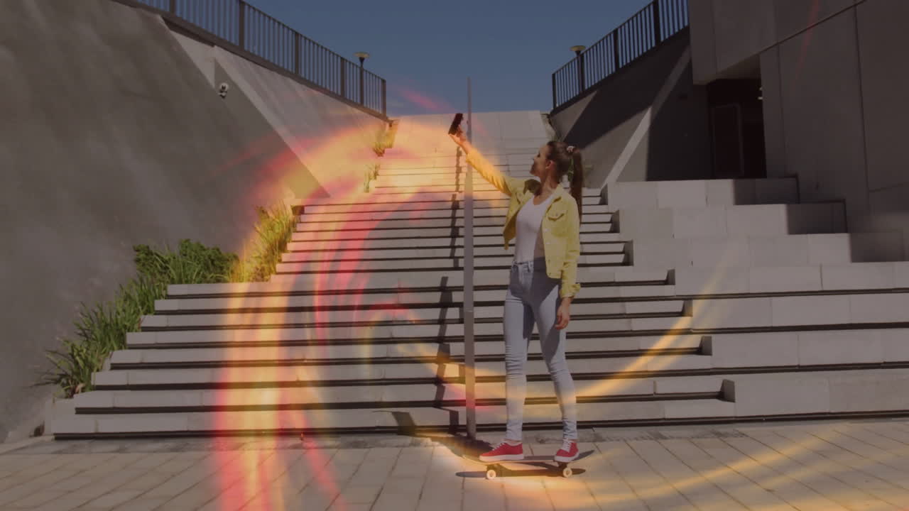 Woman balancing skateboard on stairs, taking phone selfie with floating charts for tech marketing