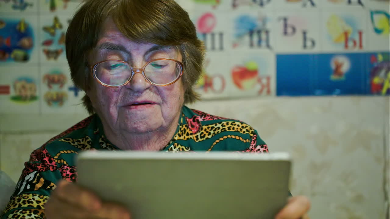 Senior woman using touch pad and talking