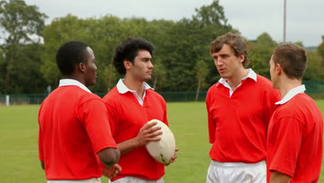 rugby players chatting together