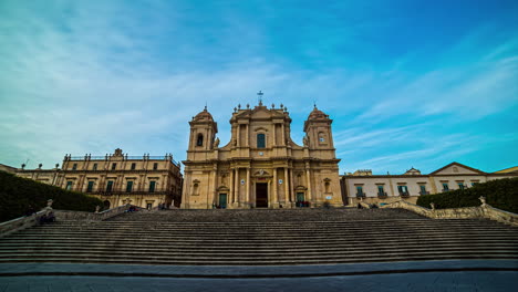 front low shot of noto cathedral in sicily, italy at daytime with cloud movement in timelapse