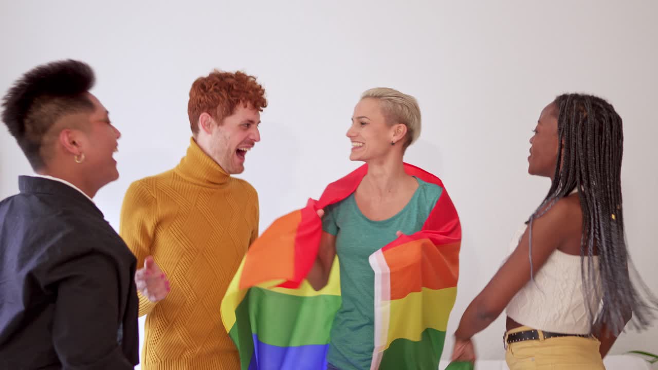 Diverse Group of Friends Joyfully Celebrating with a Pride Flag