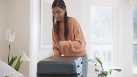 happy, woman suitcase and packing at home