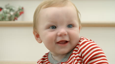 Slow-Motion-Shot-Of-Toddler-Sitting-On-Stairs-At-Christmas