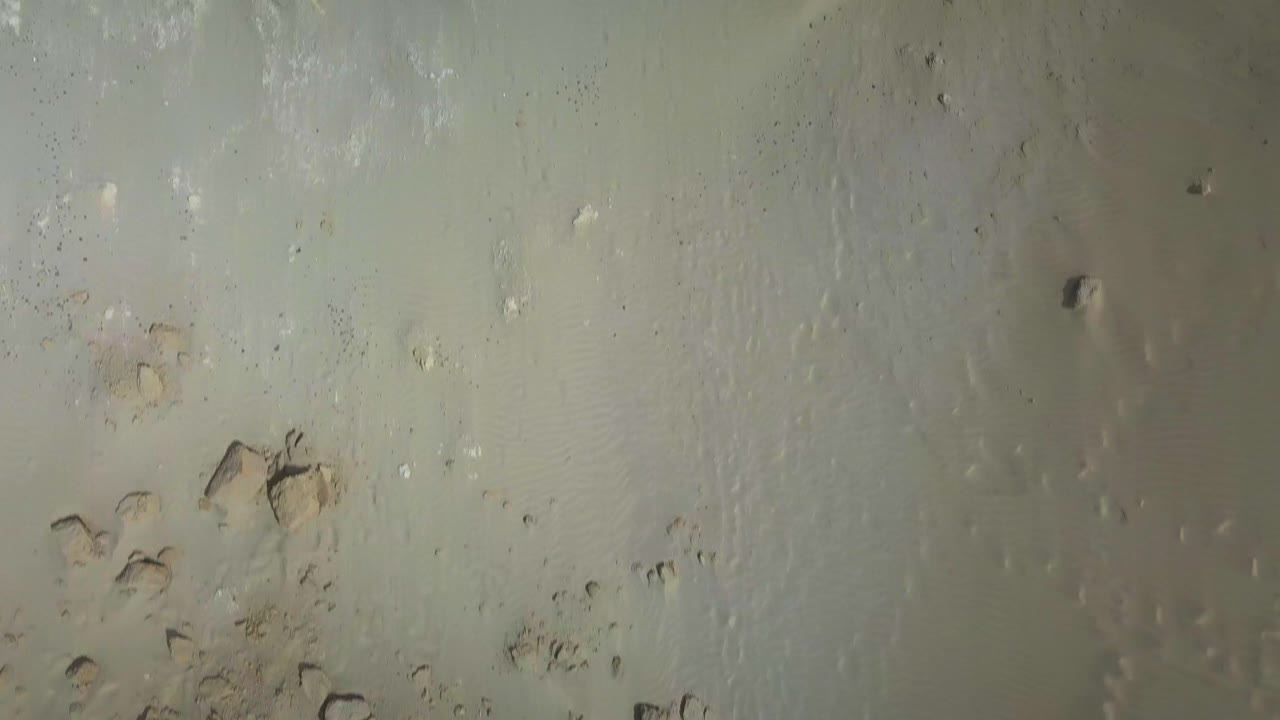 Overhead flyover of the Giant Sand Dunes in Te Paki, New Zealand