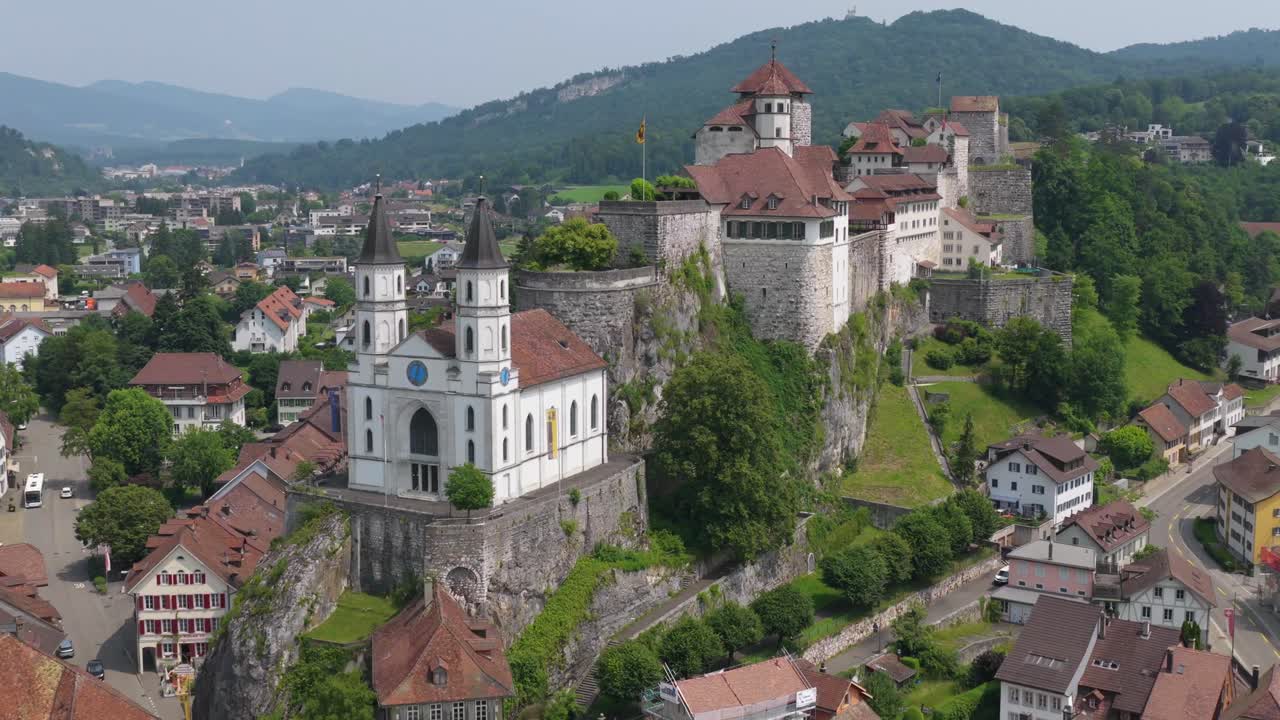Diagonal angle of both church and castle complex at edge of the forested hill