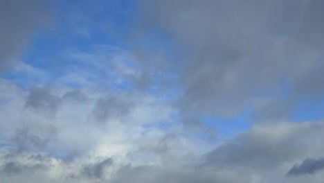 Time-Lapse-shot-of-fast-moving-clouds-with-seen-through-blue-sky