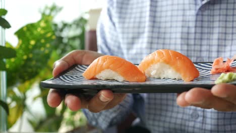 salmon sushi served on a plate