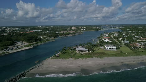 drone over jupiter inlet jetty towards jupiter inlet colony in south florida