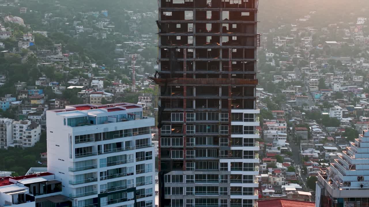 Aerial view of unfinished buildings in Acapulco at sunset, Mexico