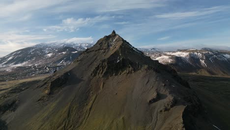 aerial view of an icelandic mountain peak, cloudy day, alpine view