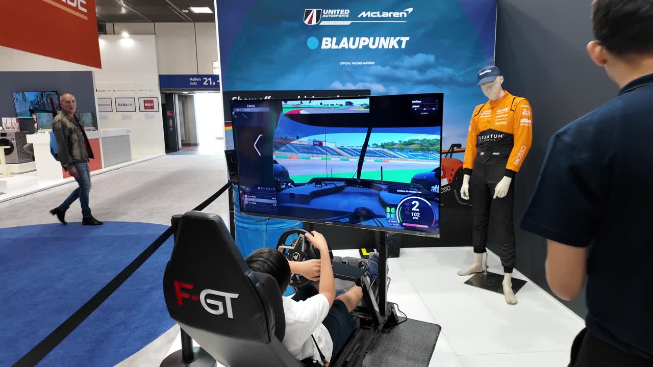 A gaming simulator setup at the IFA Berlin showcases Blaupunkt technology in immersive racing