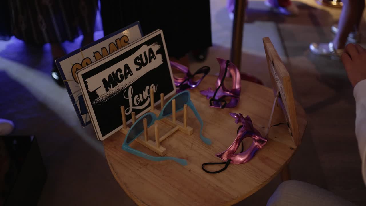 Colorful props and signs arranged for guests on a party table location irrelevant