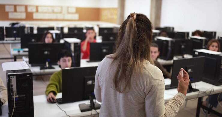 Teacher Leading a Computer Class for Students
