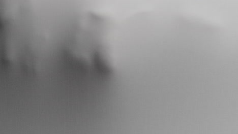 a creepy silhouette of a woman's body appears from the white surface