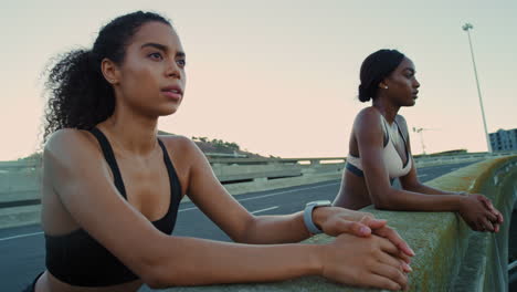 Black-women,-breathing-or-fitness-break-on-city