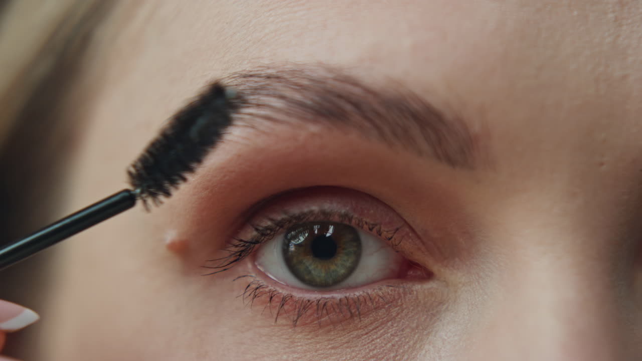 Close-up of eye and eyebrow with makeup application