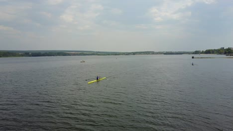 athletes training on kayaks. group of young athletes training for whitewater rafting
