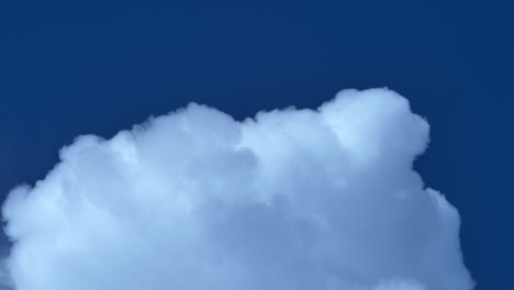 fluffy white cumulus clouds on a clear weather