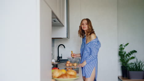 woman whisking eggs