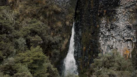 volcanic mountains with the cascades in parque nacional cayambe-coca near papallacta, ecuador