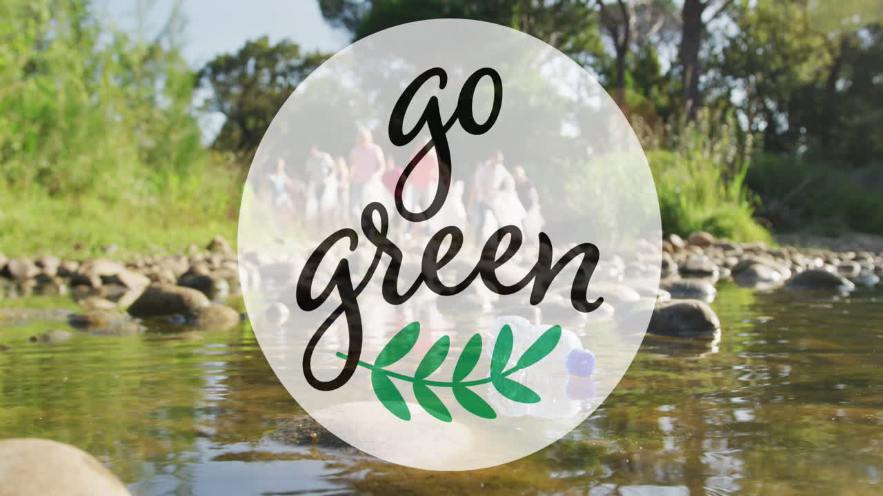 Animation of go green text and logo over diverse group collecting rubbish in countryside