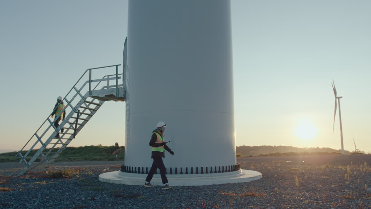 Service Technicians Inspecting Turbines at Wind Farm