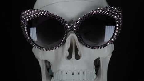 human skull with sunglasses