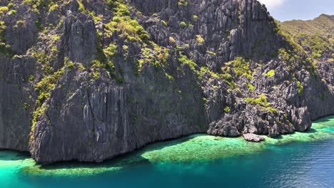 scenic aerial view of an exotic and breathtaking north of talisay beach, tapiutan island, philippines