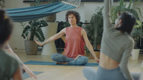 young women stretching on group yoga
