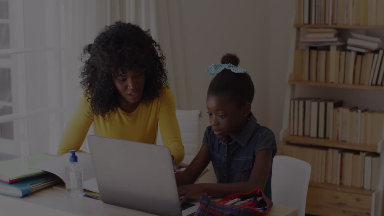 Animation of financial data processing over mother and daughter with laptop