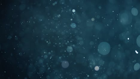 floating abstract particle bokeh on dark background