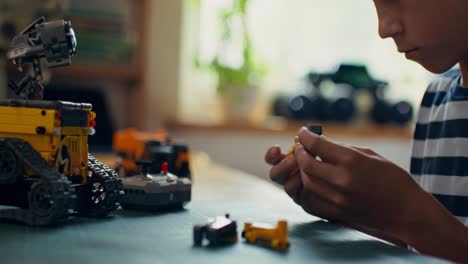 child building a lego robot