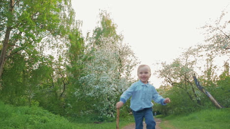 happy child running on the path in park