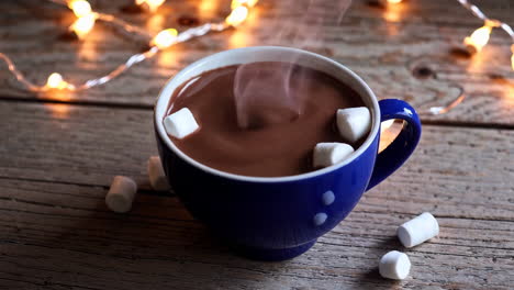 hot chocolate with marshmallows on a wooden table