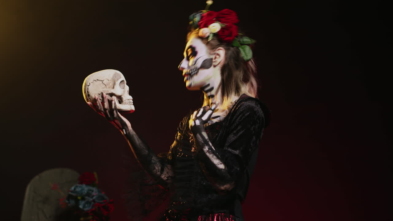 Woman in Skeleton Makeup Holding Skull