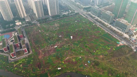 drone orbit shot of an empty land waiting for construction to start. outskirts of chongqing, china